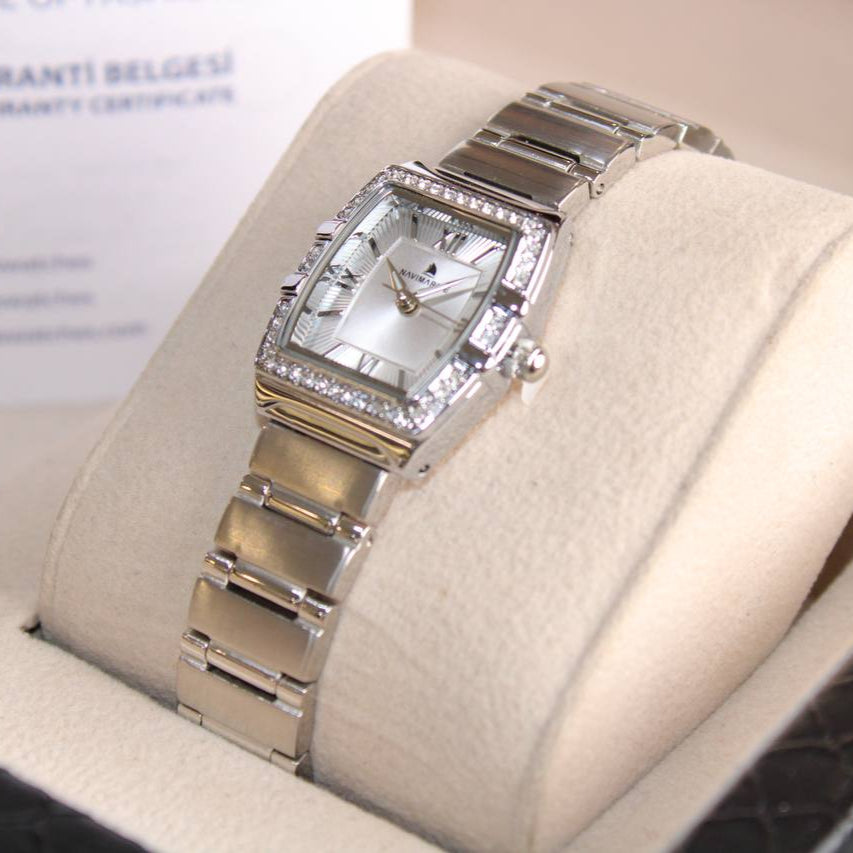 Silver watch with a diamond-studded face in a display case