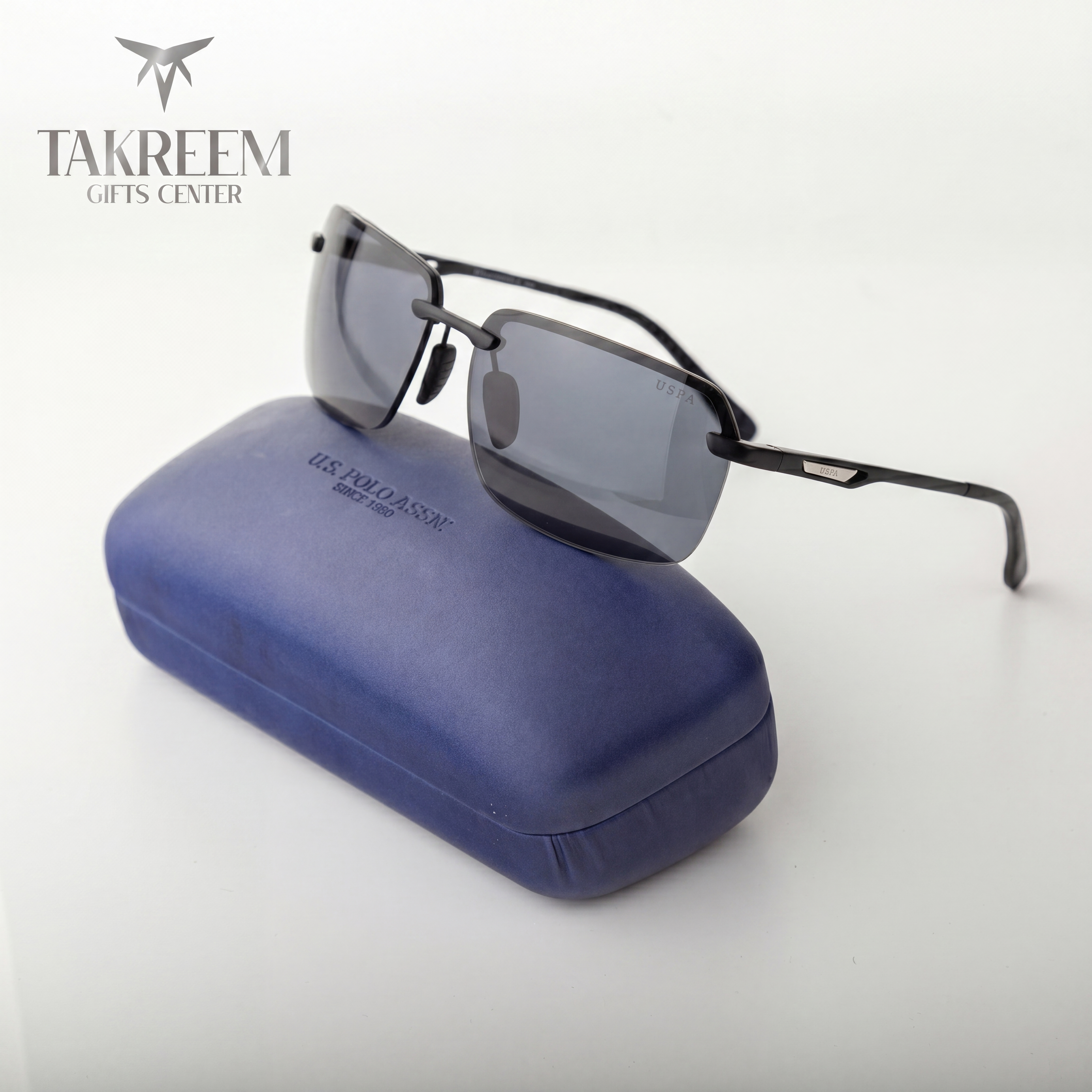 Sunglasses with a blue case on a white background, featuring the Takreem Gifts Center brand.