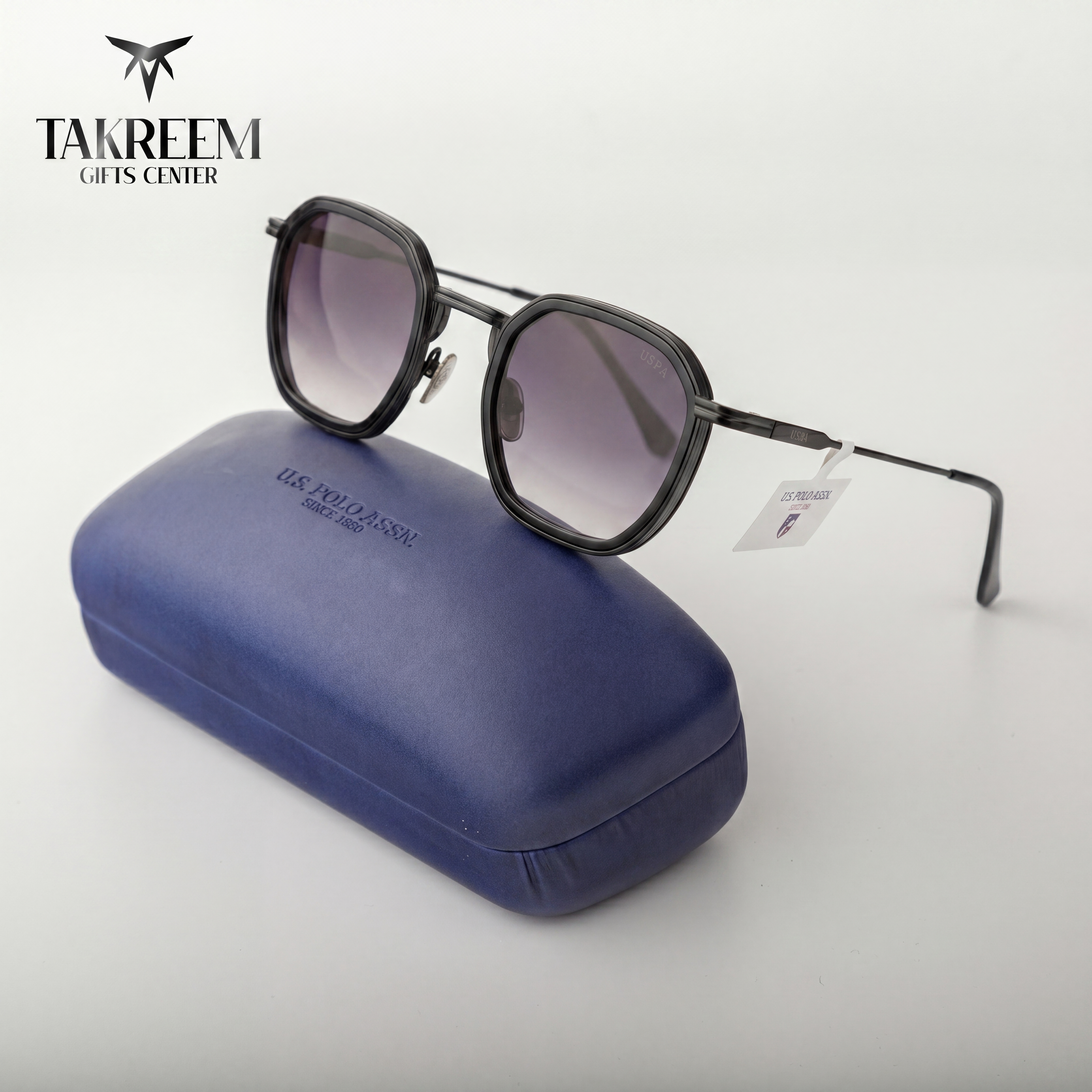 Sunglasses with a blue case on a white background, featuring the Takreem Gifts Center brand.