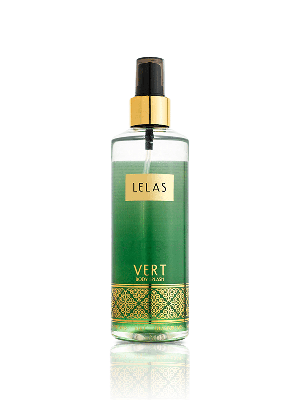 A clear glass spray bottle of LELAS Vert Body Spray with a green liquid inside, a gold collar, and a black spray nozzle, set against a plain white background with a soft reflection below.